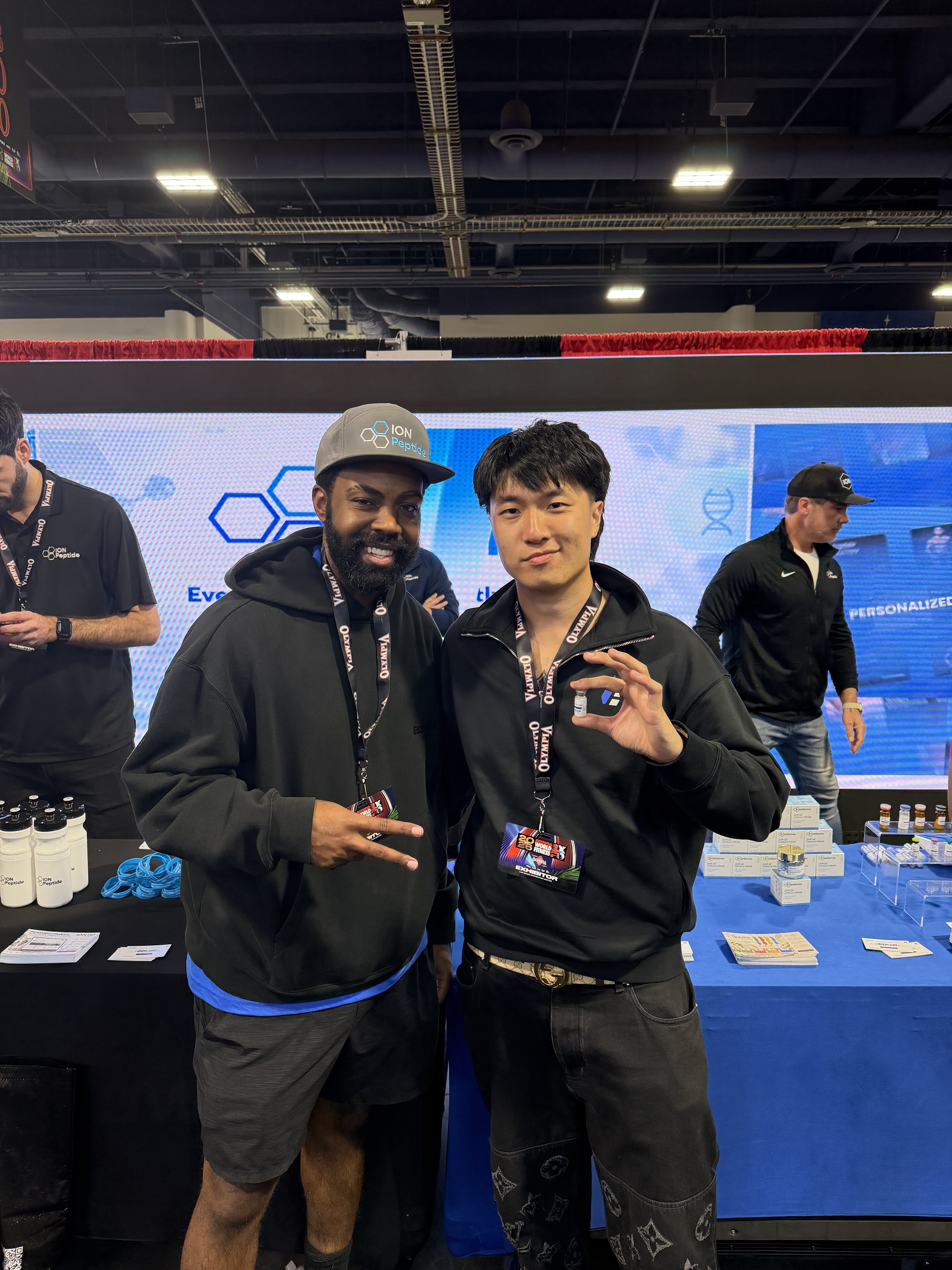 Group photo at the Ion Peptide booth
